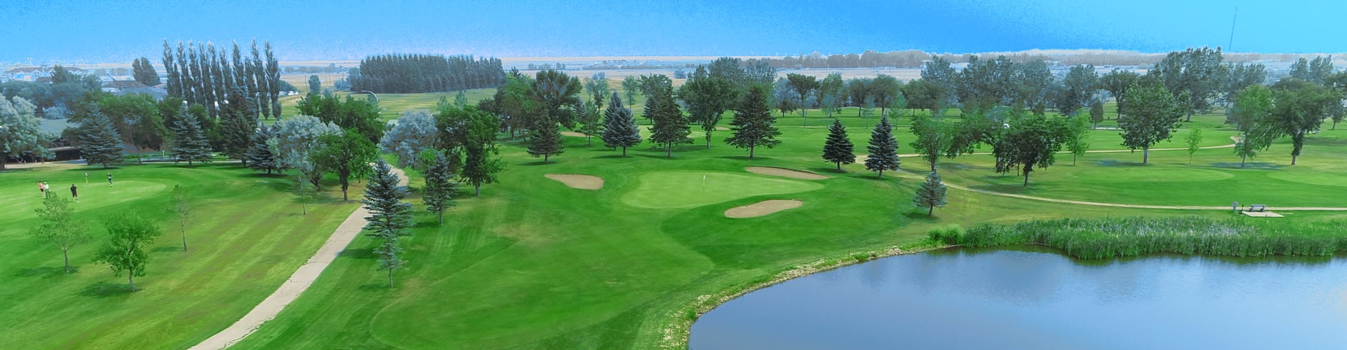 Image of golf ball on tee on grass.